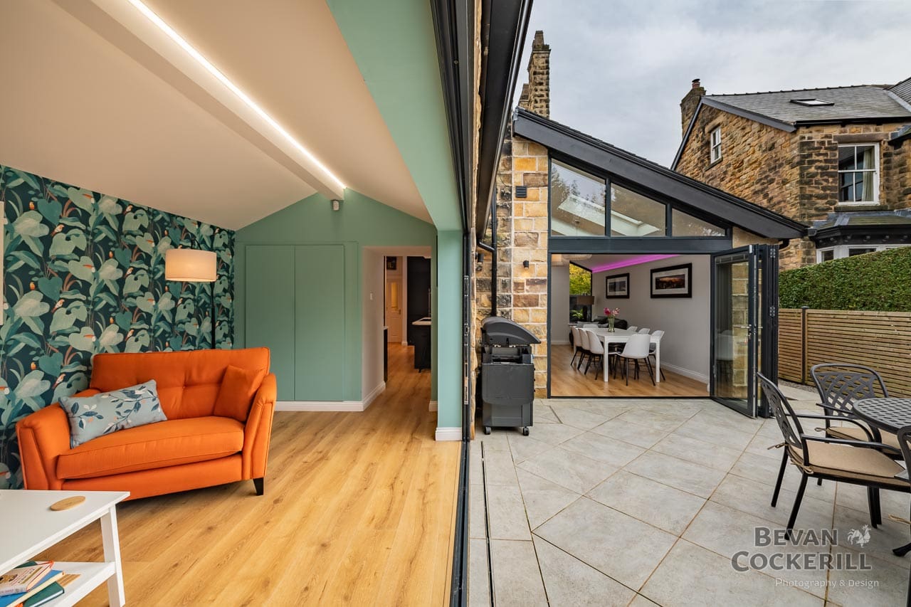 Kitchen Extension - Builders Photos by Bevan Cockerill- Seeing bi-fold doors open to see inside and outside in one shot