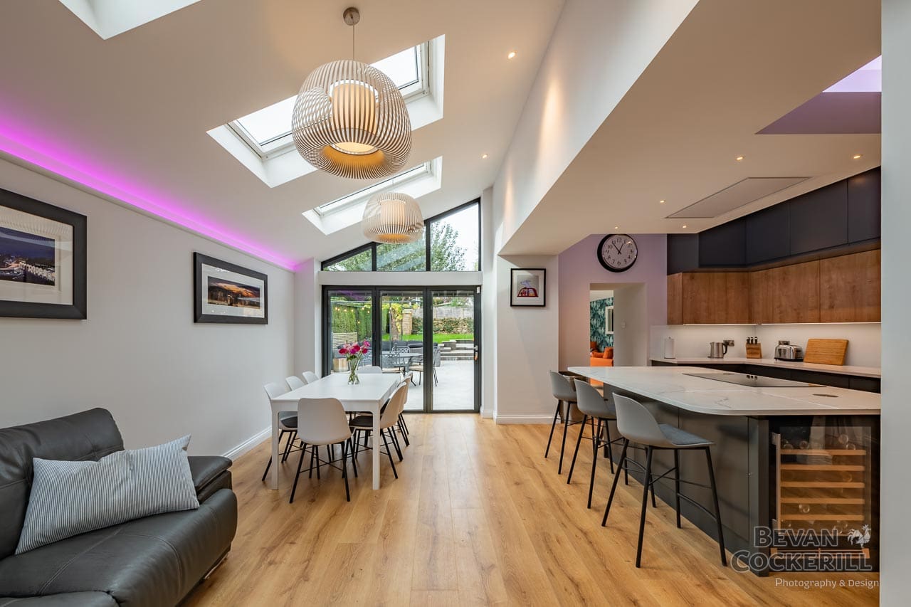 Kitchen Interior with skylight, island unit and bi-folding doors.